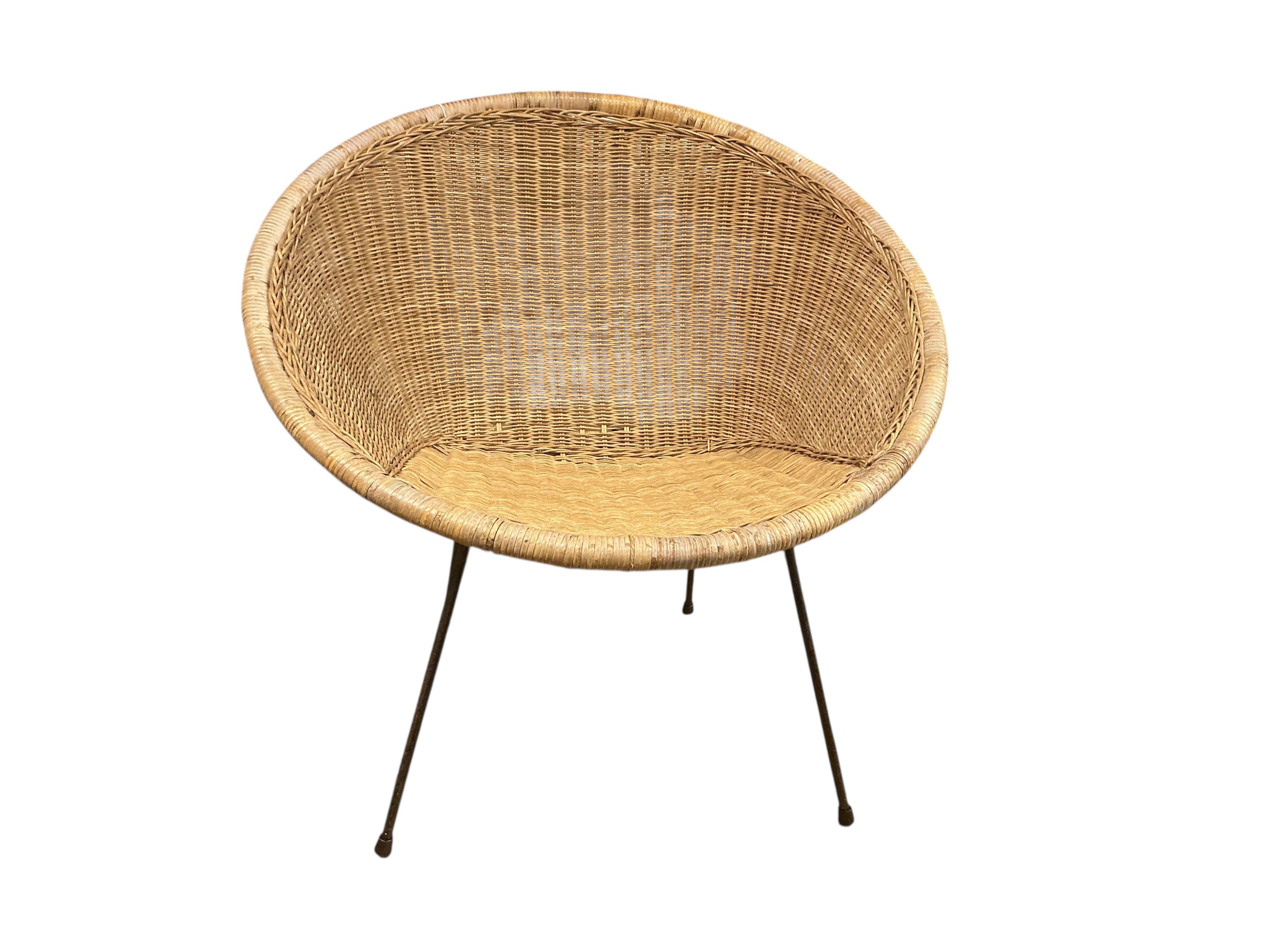 A mid century cane chair, width 74cm, height 73cm